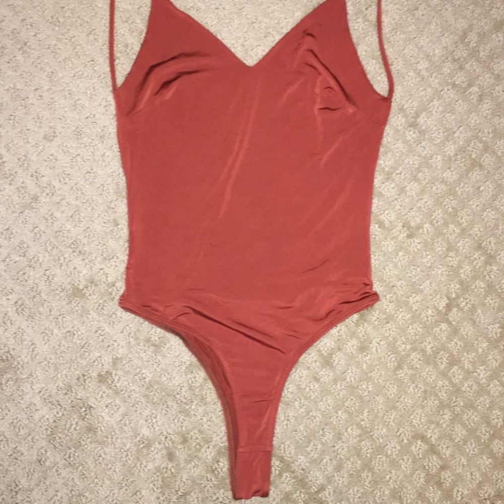 Orange open back body suit